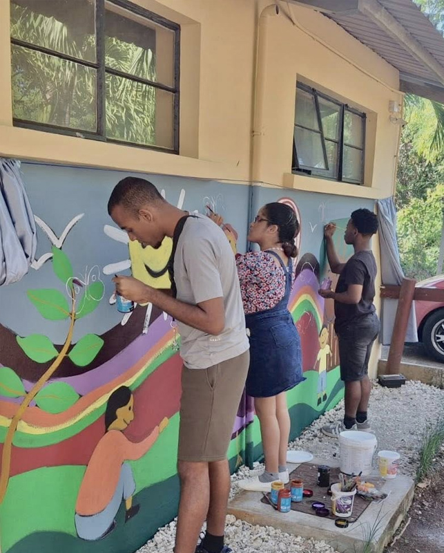 Students painting a mural at the Fondation Georges Charles